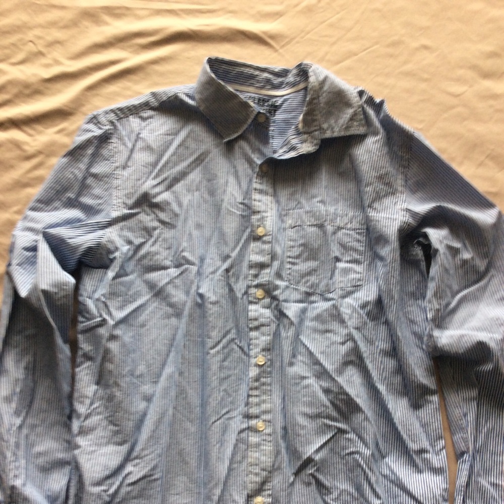 White with blue stripes button shirt.